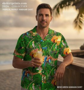 Mens green Hawaiian shirt worn on a tropical beach — dark palm leaf print aloha shirt for men and women at SKShirtPrints